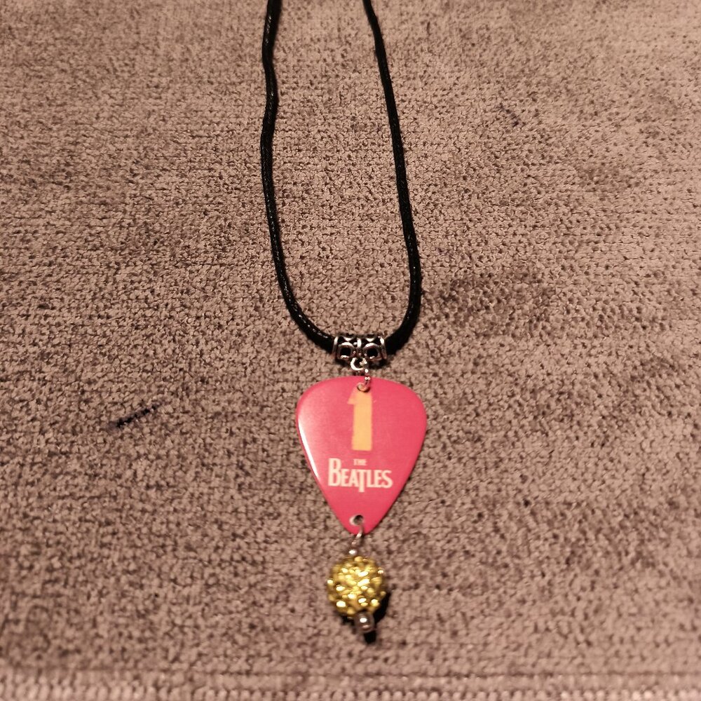 THE BEATLES NUMBER ONES GUITAR PICK NECKLACE